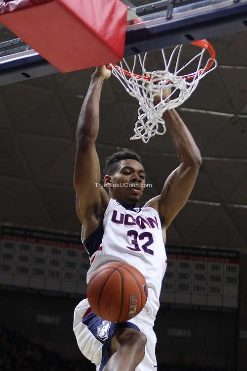 UConn’s Shonn Miller (32) slams the ball home for two of his 18 points.